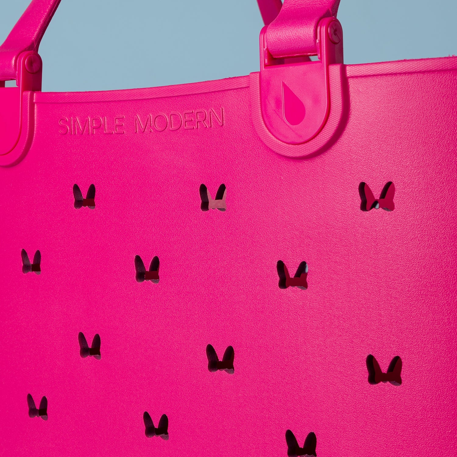 Vibrant hot pink and magenta background with muted blue-gray tones in upper portion, creating bold color contrast