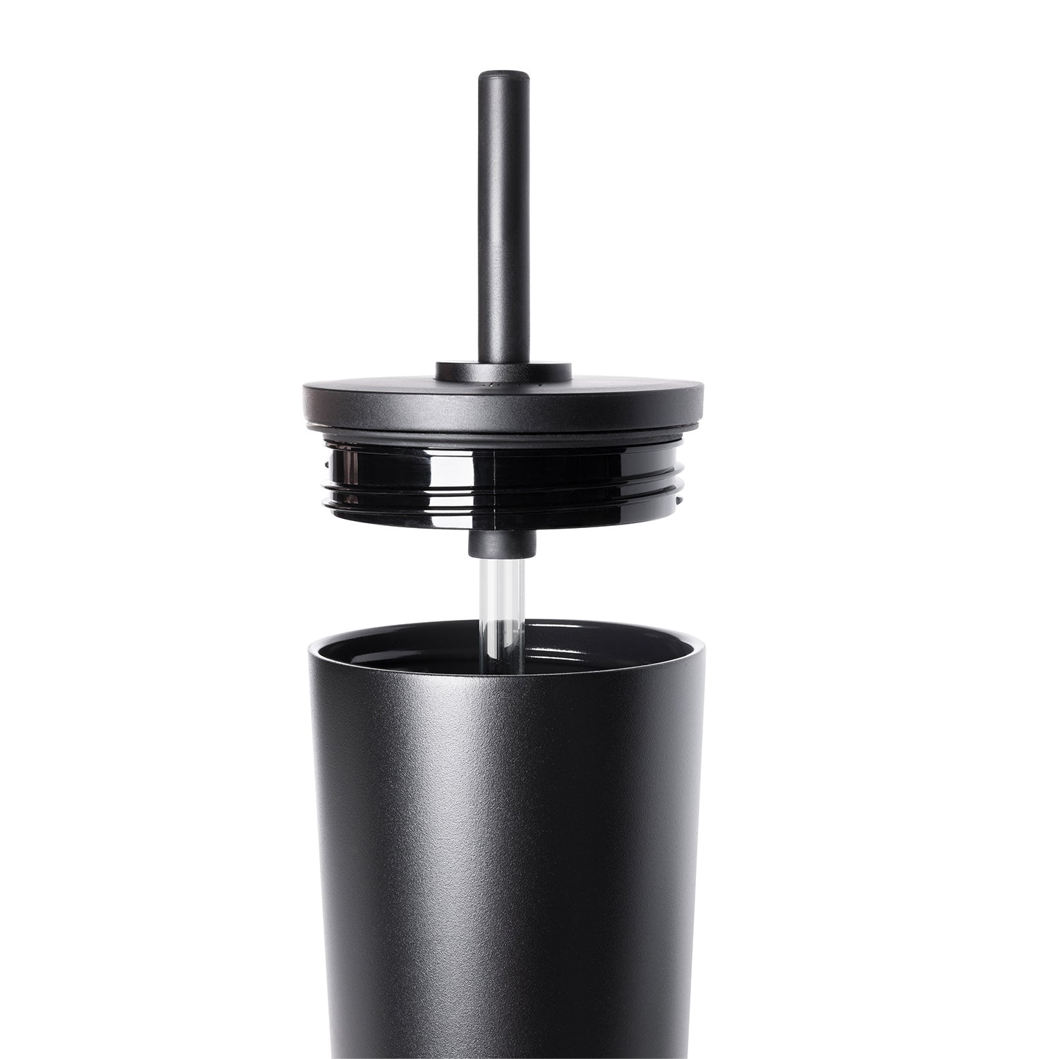 Black matte stainless steel tumbler with matching lid and straw, showing metallic gray reflections on the surface
