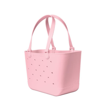Soft pale pink tote bag displayed against a clean white background