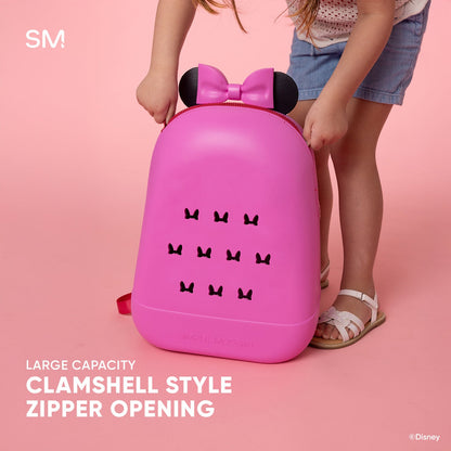Hot pink Disney children's backpack with black bow-shaped ears and decorative bow icons, shown open against a soft pink background to display the clamshell opening design.