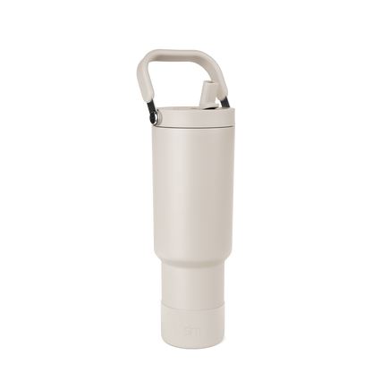 Off-white cream portable storage product with matte black carrying handle and metallic silver hardware details
